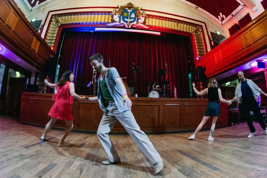 Dancing in front of the stage in a grand Glasgow hall
